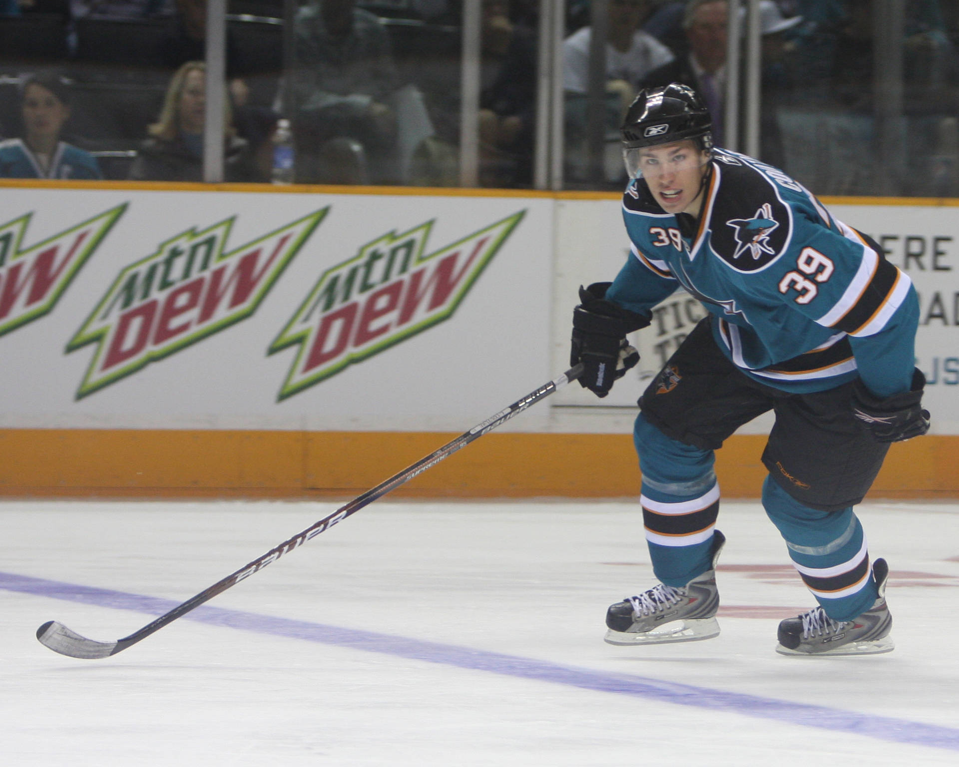 Canadian Professional Ice Hockey Center Logan Couture On Rink Background