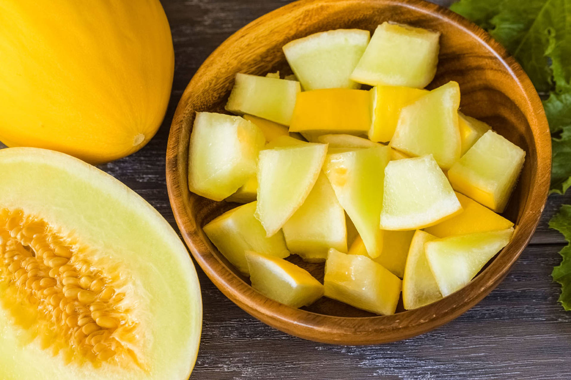 Canary Melon Cut In Bowl Background