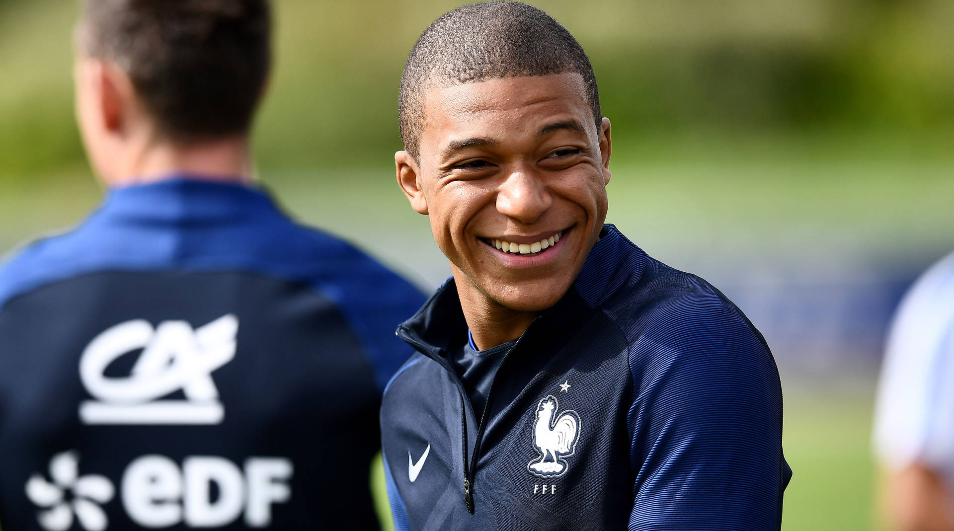 Candid Smiling Kylian Mbappe Background