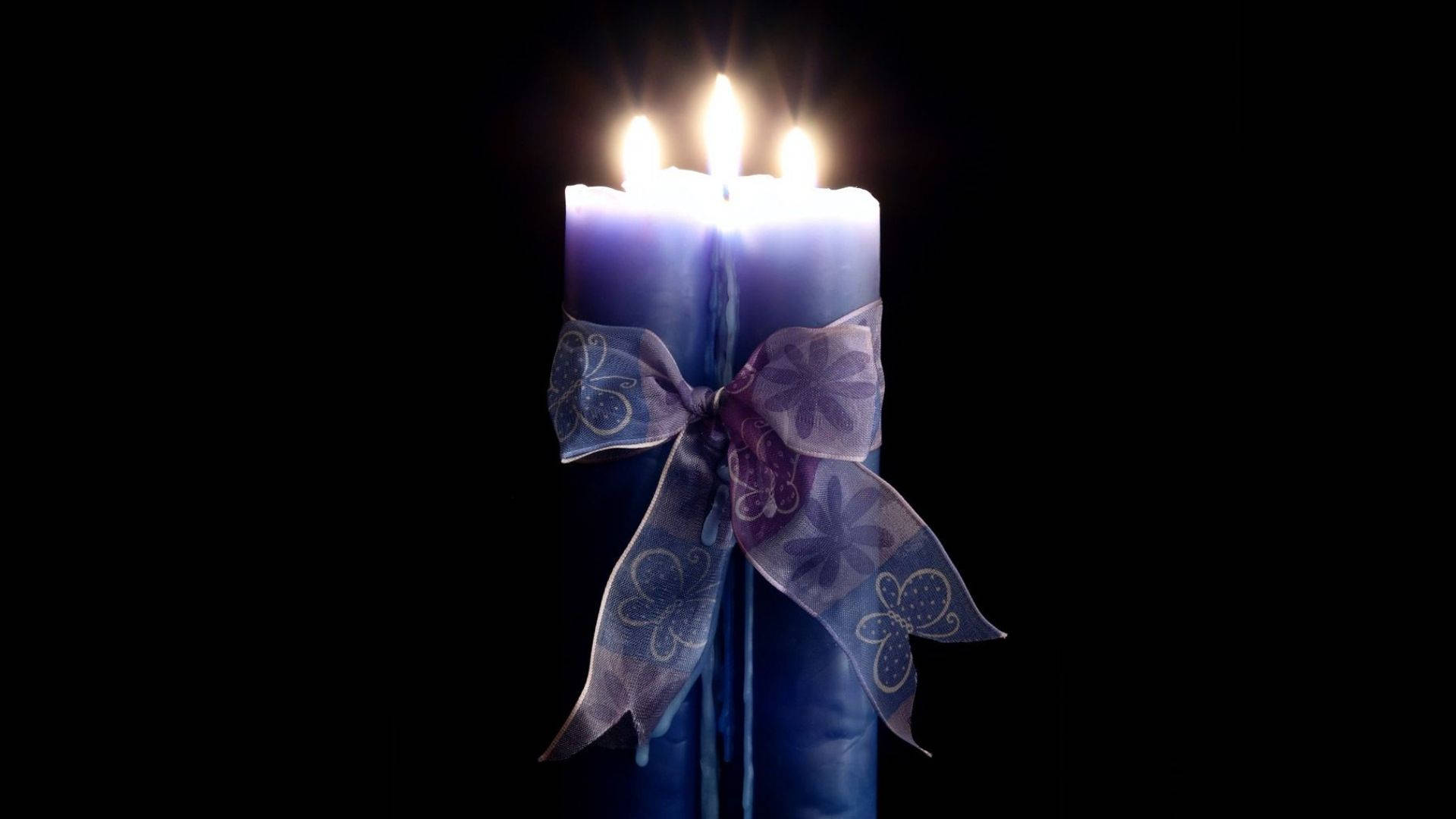 Candles With A Ribbon Background