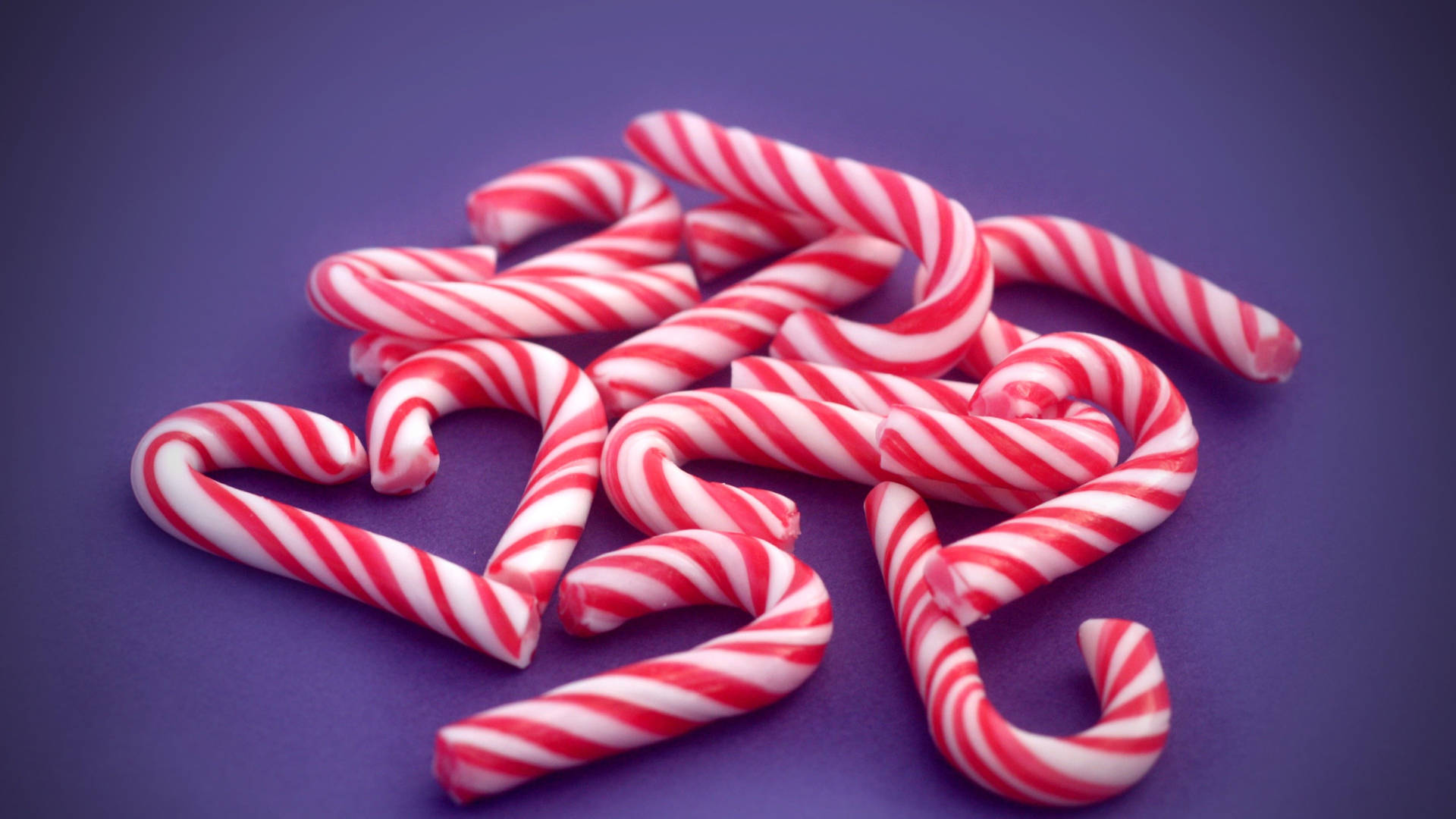 Candy Cane In Purple Background Background