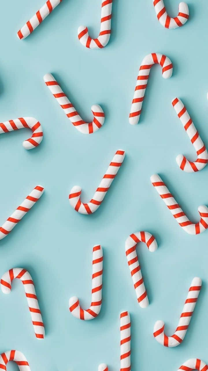 Candy Canes On A Blue Background Background