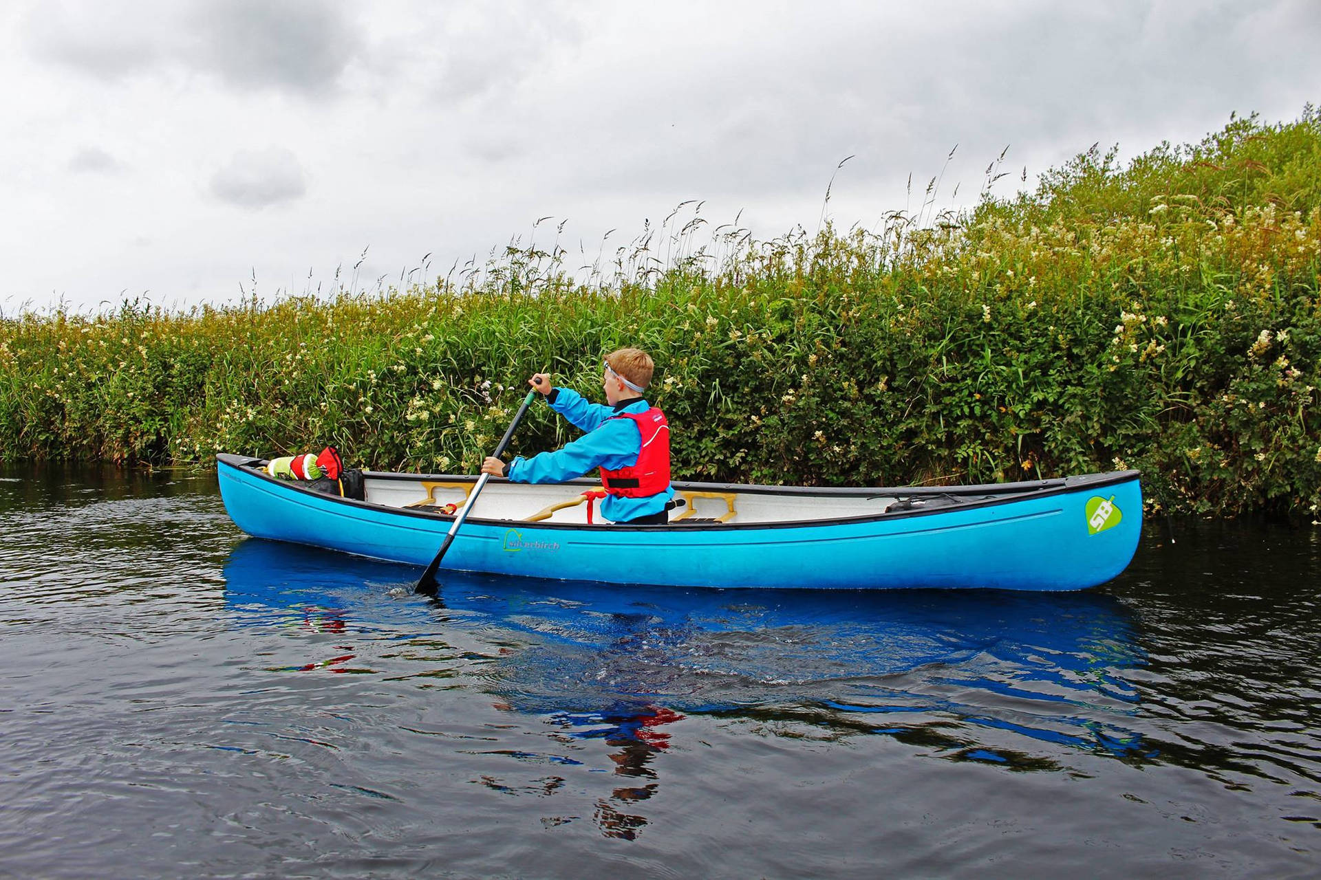 Canoeing In Blue Boat