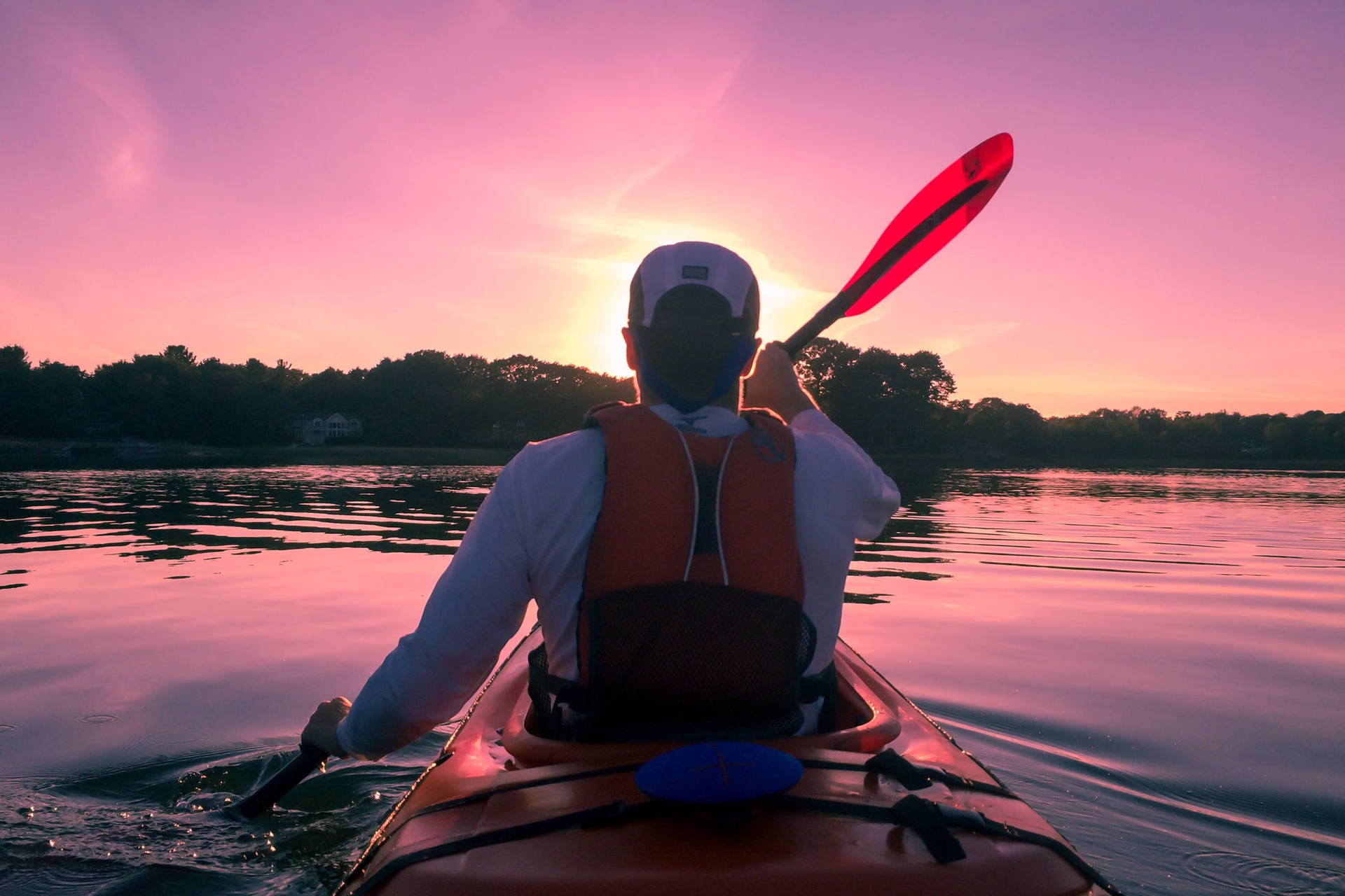 Canoeing In Purple Sunset Background