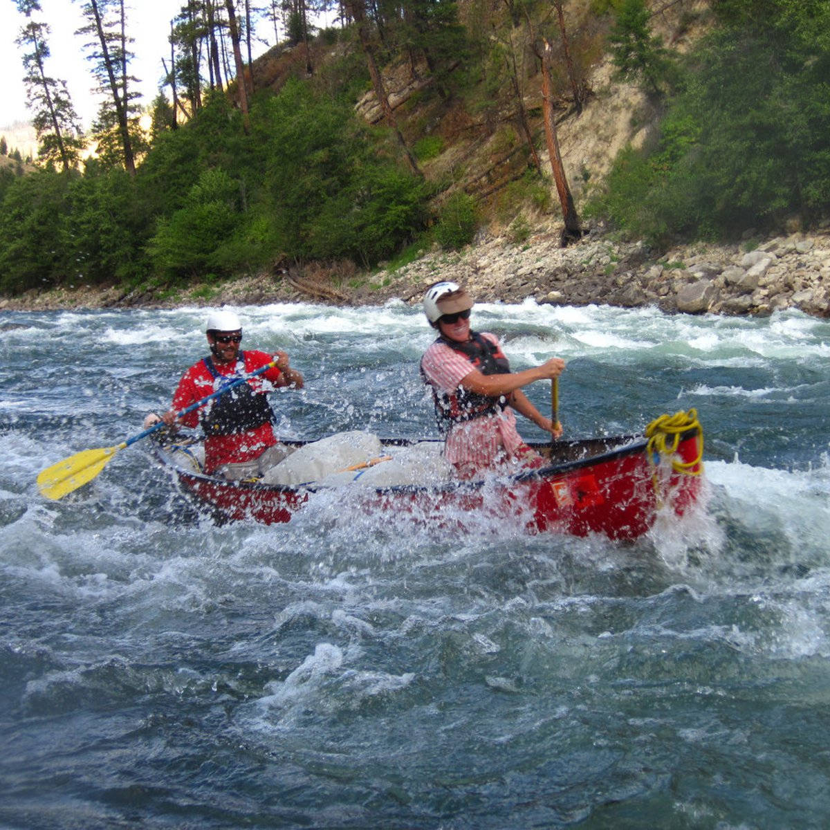 Canoeing In Strong Waves Of The River Background