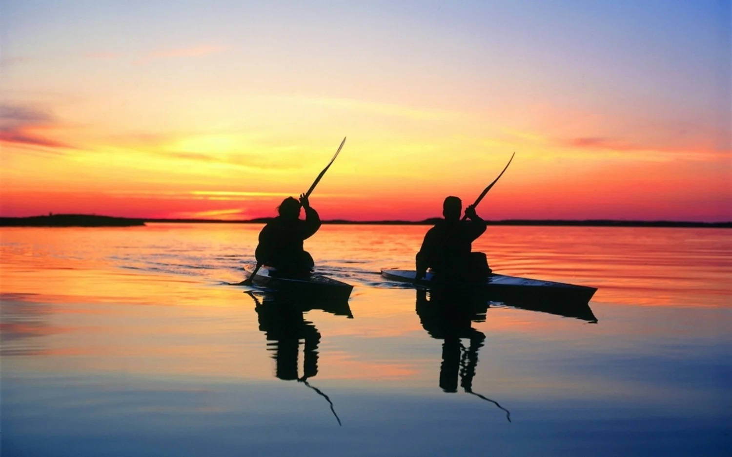 Canoeing In Sunset Background