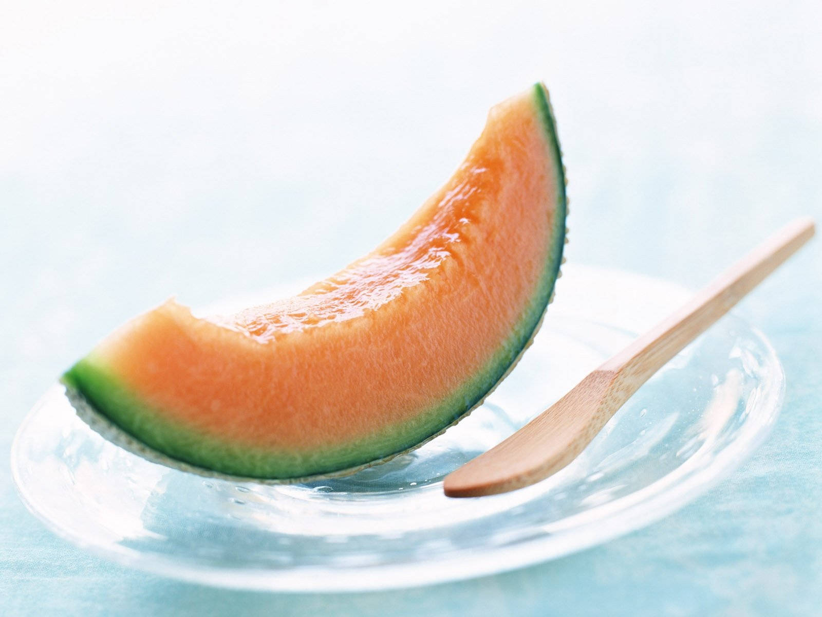 Cantaloupe On Plate Background