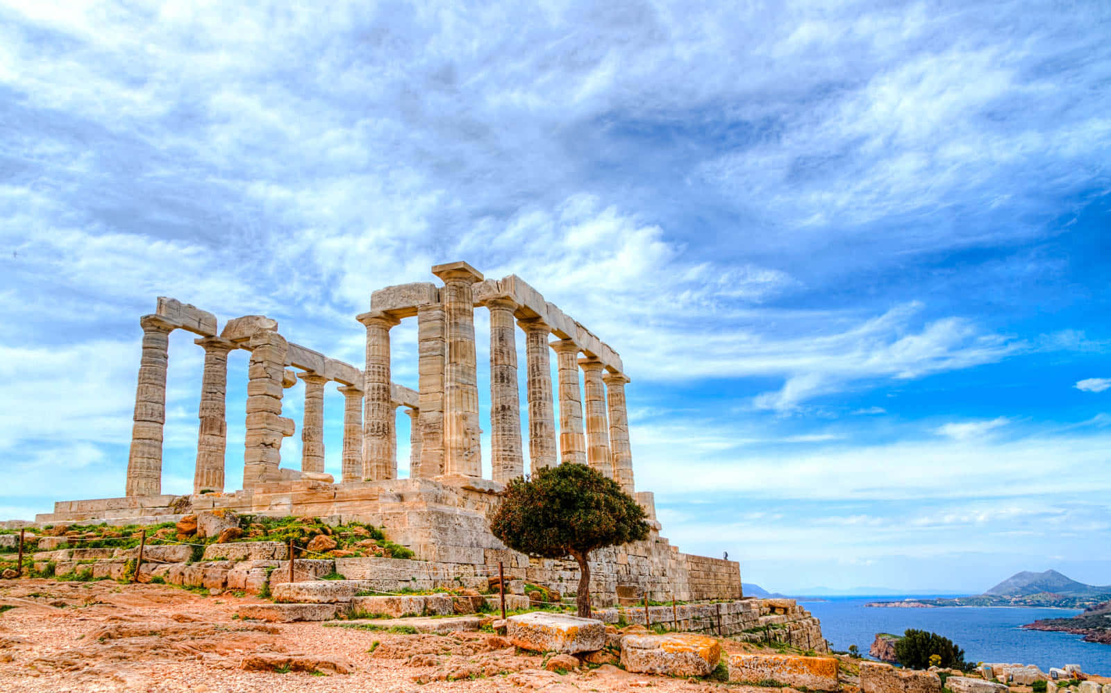 Cape Sounion Beneath Blue Sky Background