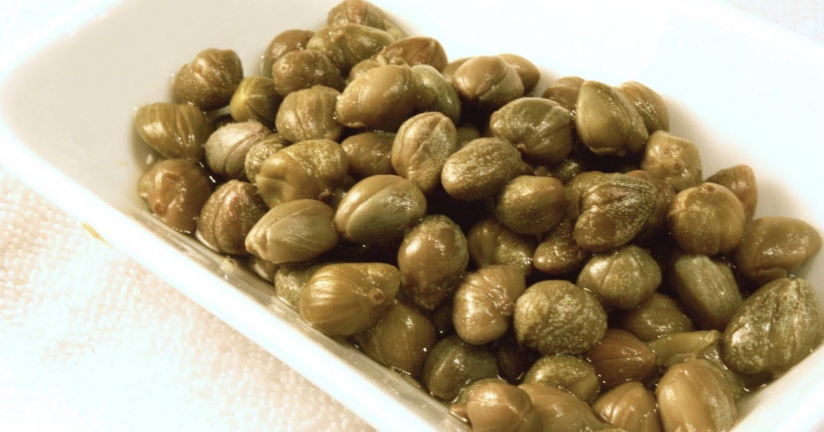 Capers Buds On A White Rectangle Platter