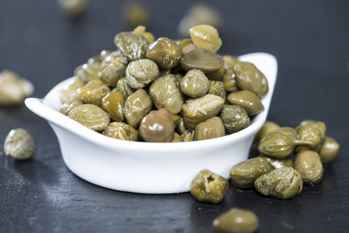 Capers In A White Ceramic Bowl