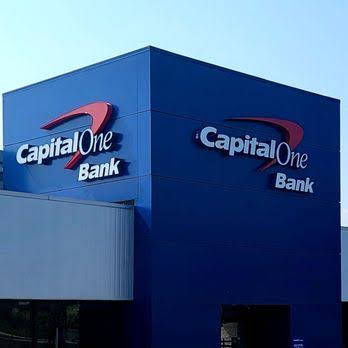 Capital One Banking App On A Smartphone Screen Background