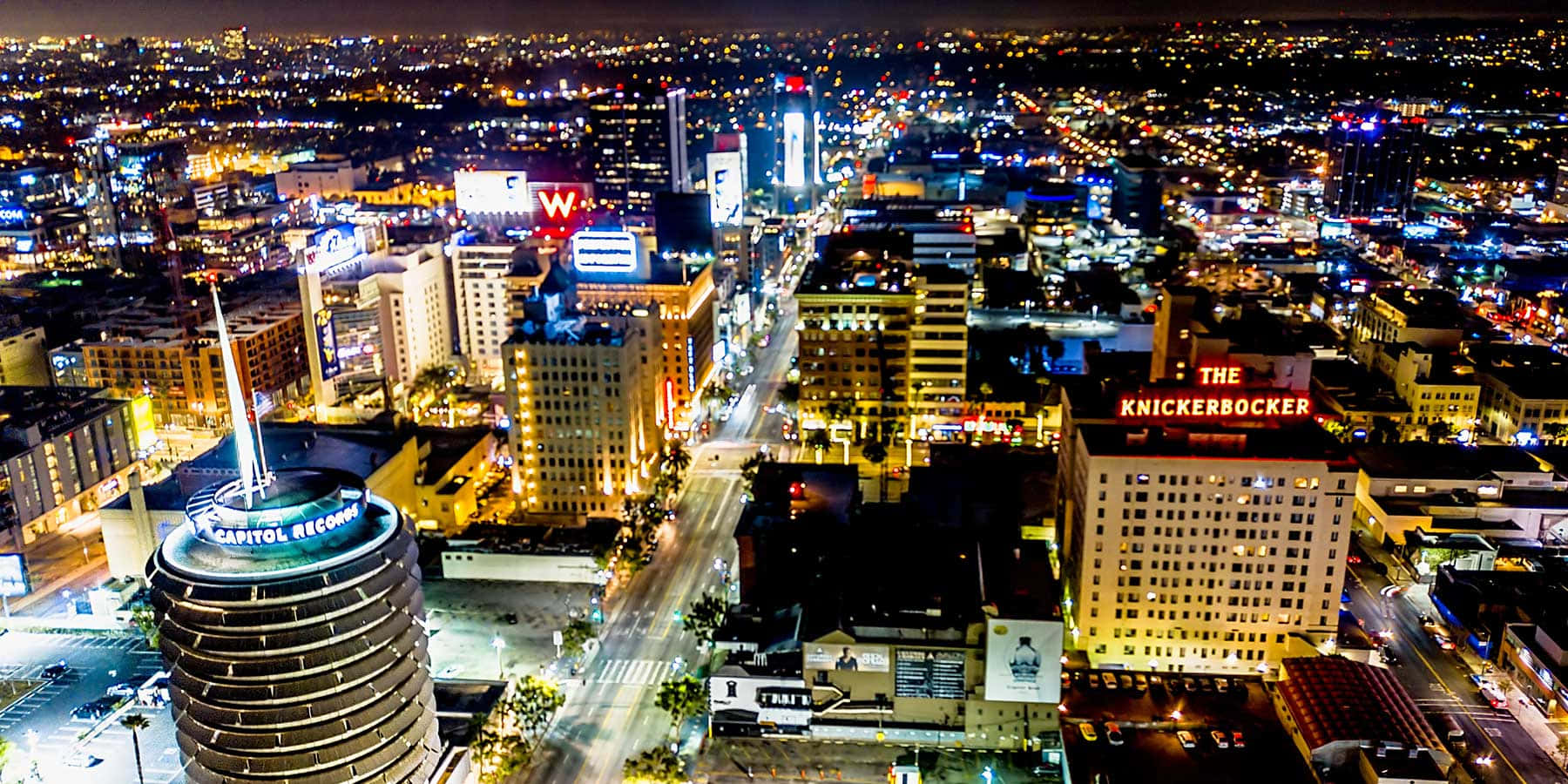Capitol Records Building Illuminated By Lights Background