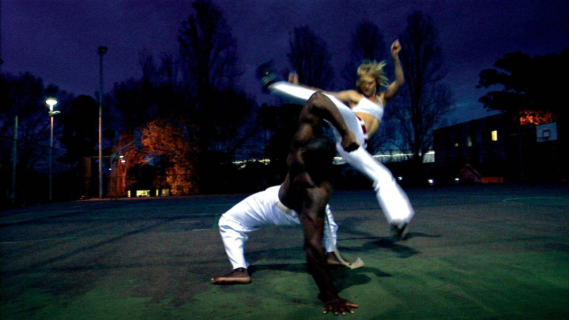 Capoeira Fight In The Evening Background