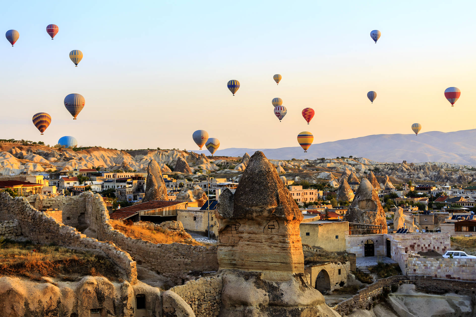 Cappadocia Balloons Flying Over Village Background