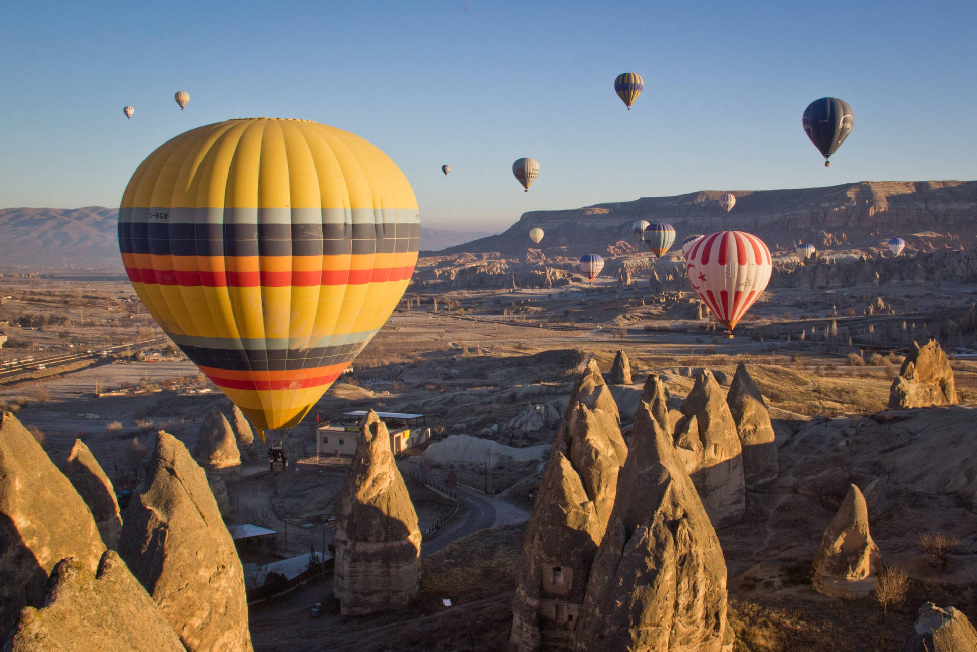 Cappadocia Balloons Over Rocks Background