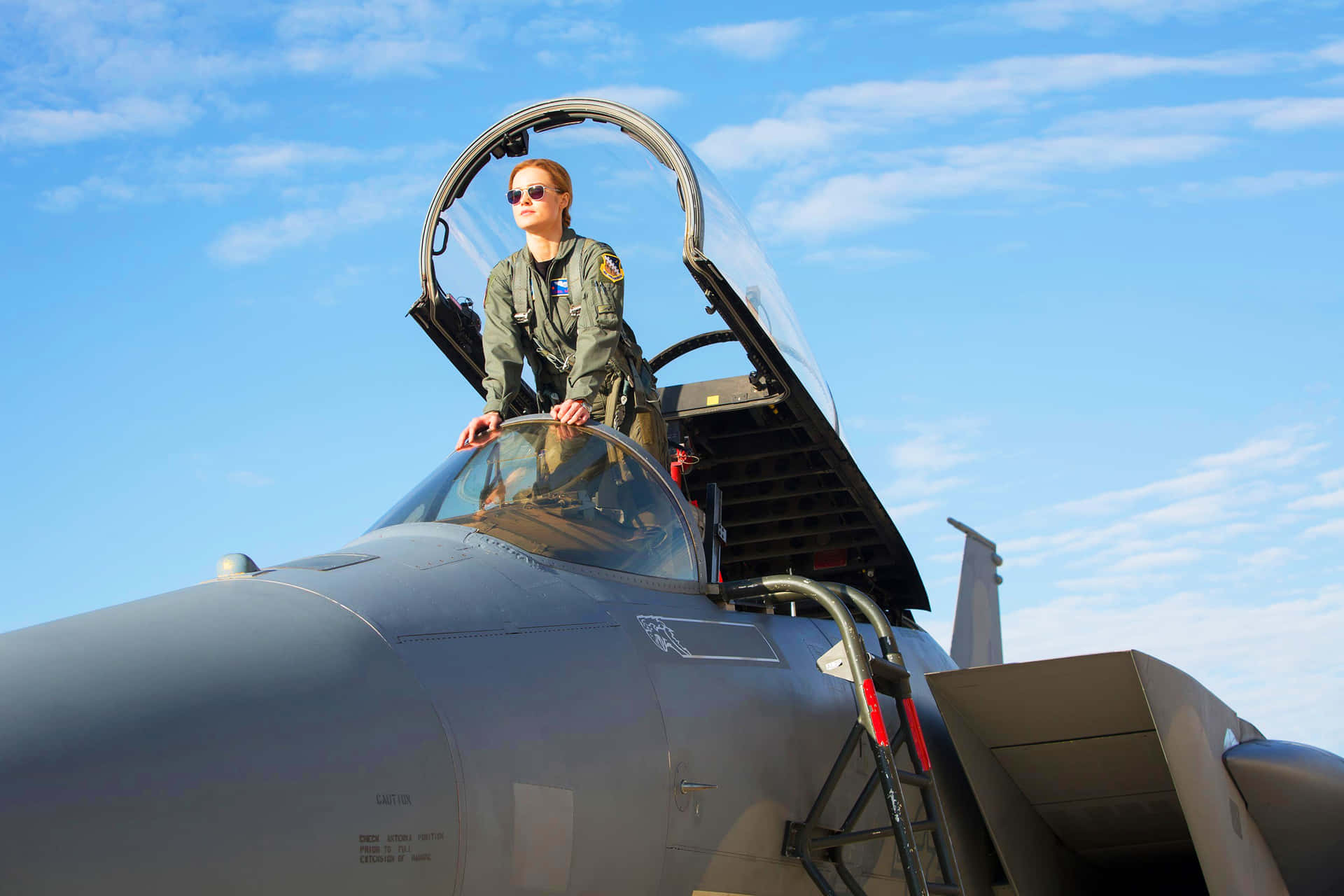 Captain Marvel Soaring Through The Sky In Her Superhuman Strength
