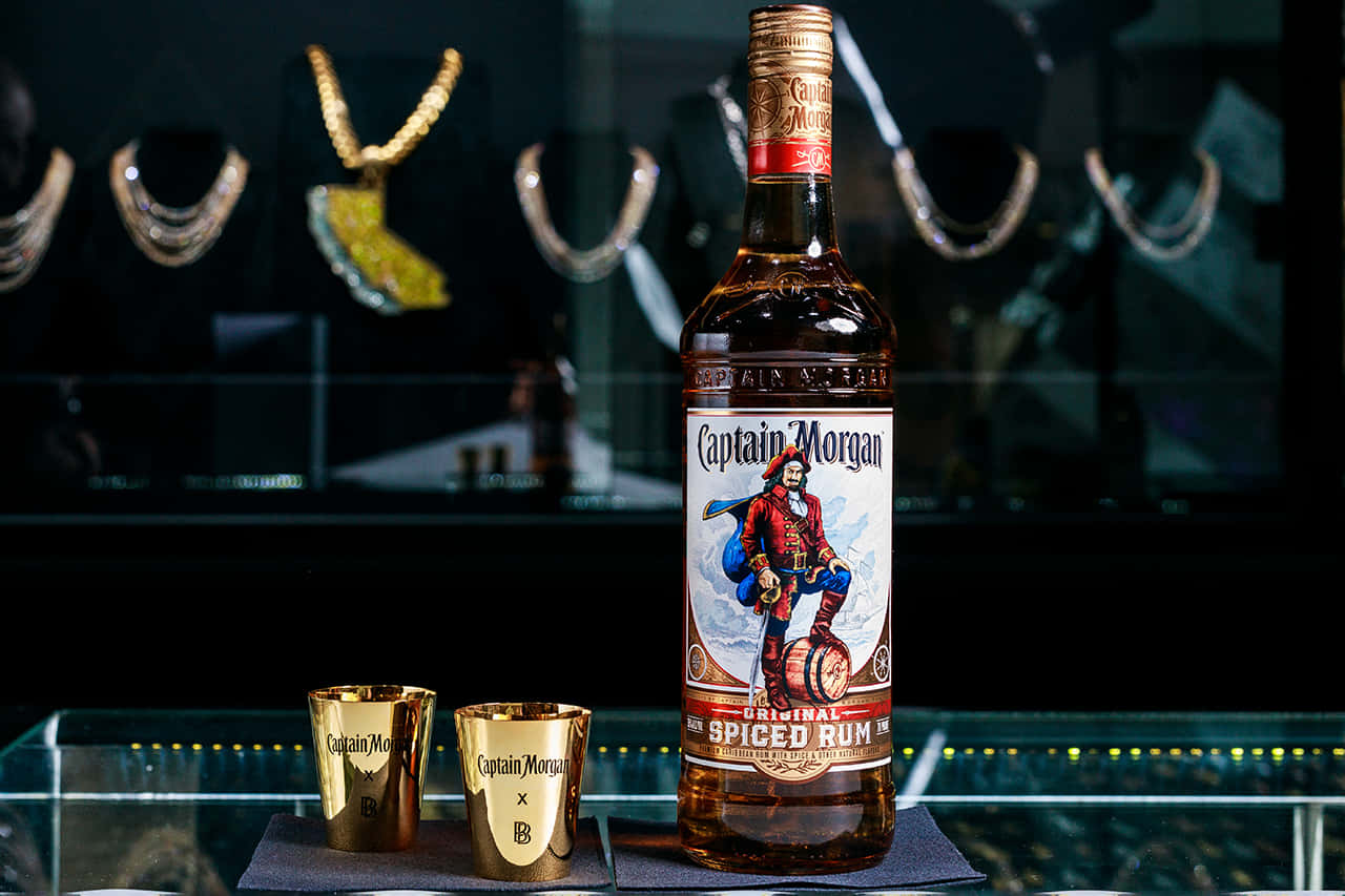 Captain Morgan Spiced Rum Bottleand Shot Glasses Background