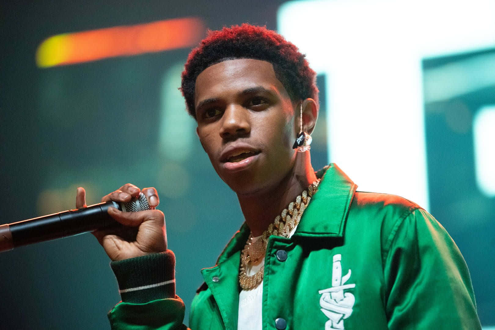 Caption: A Boogie Wit Da Hoodie Performing Live On Stage Background