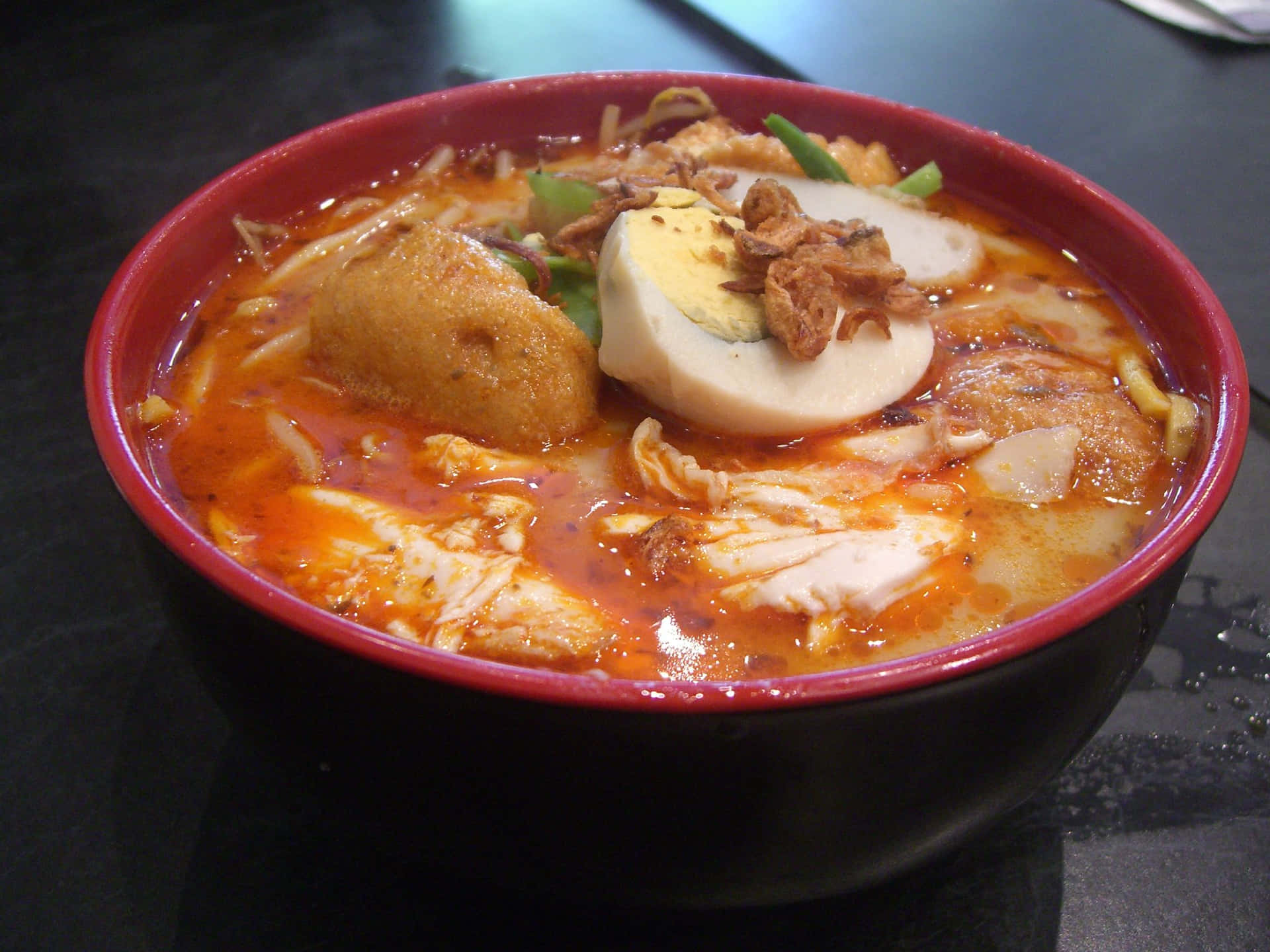 Caption: A Bowl Of Authentic Singaporean Coconut Curry Laksa