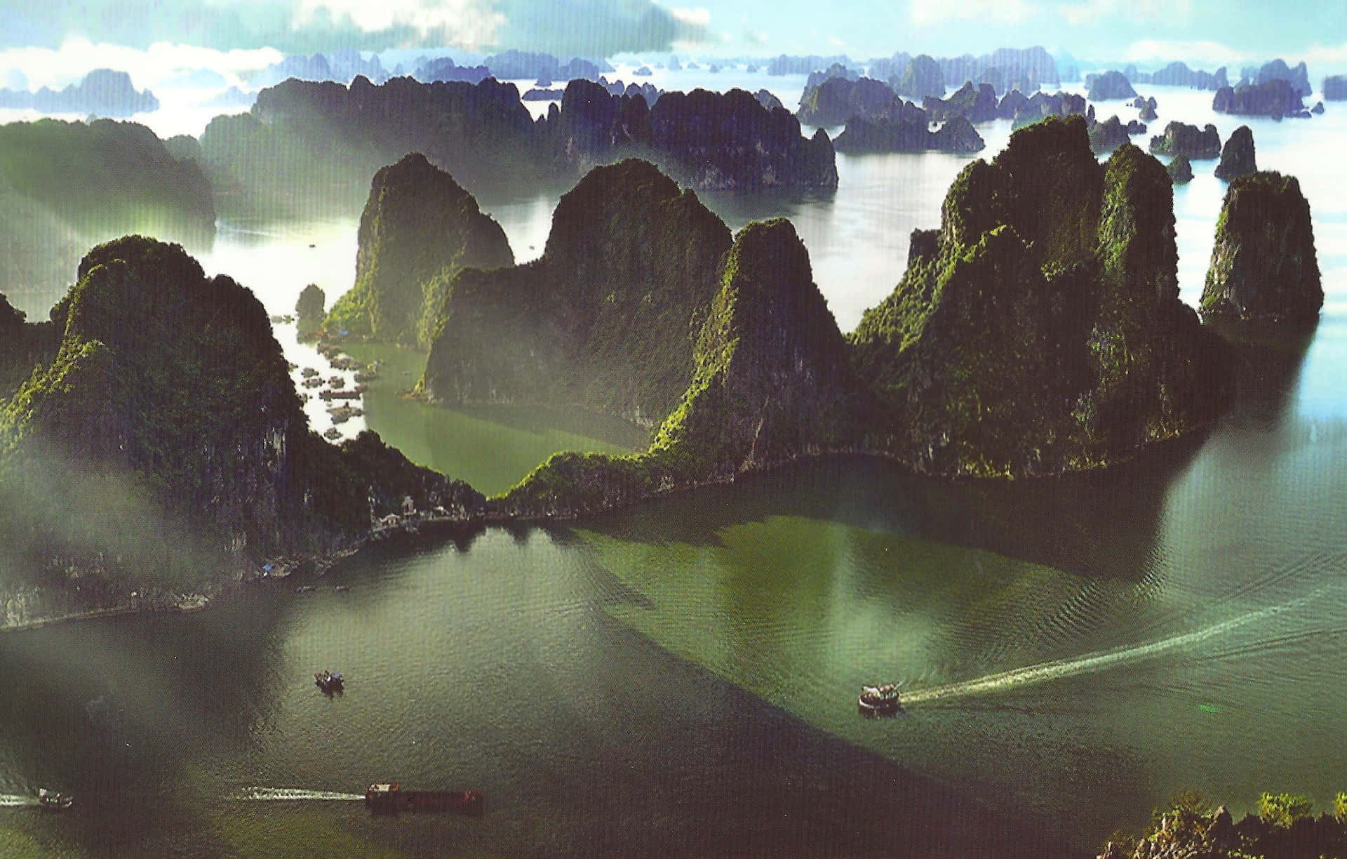 Caption: A Breathtaking View Of Halong Bay's Majestic Scenery Background