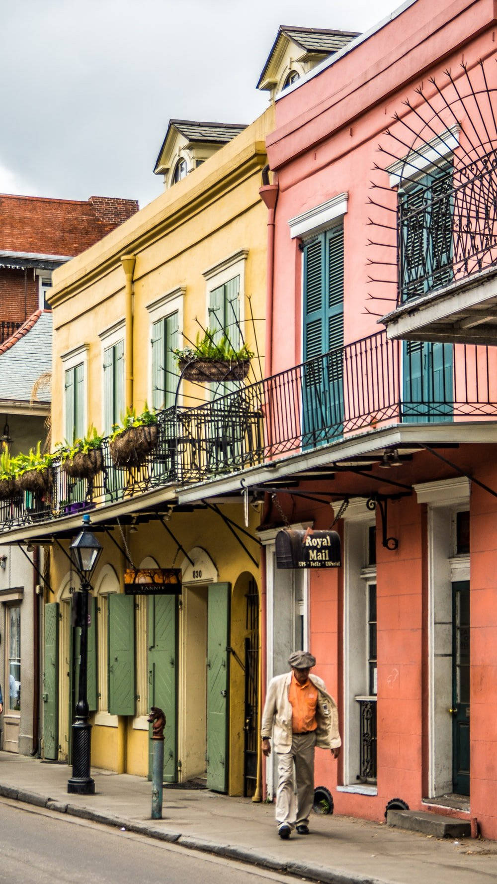 Caption: A Captivating Glimpse Of A Rustic Sidewalk In The Historic French Quarter. Background