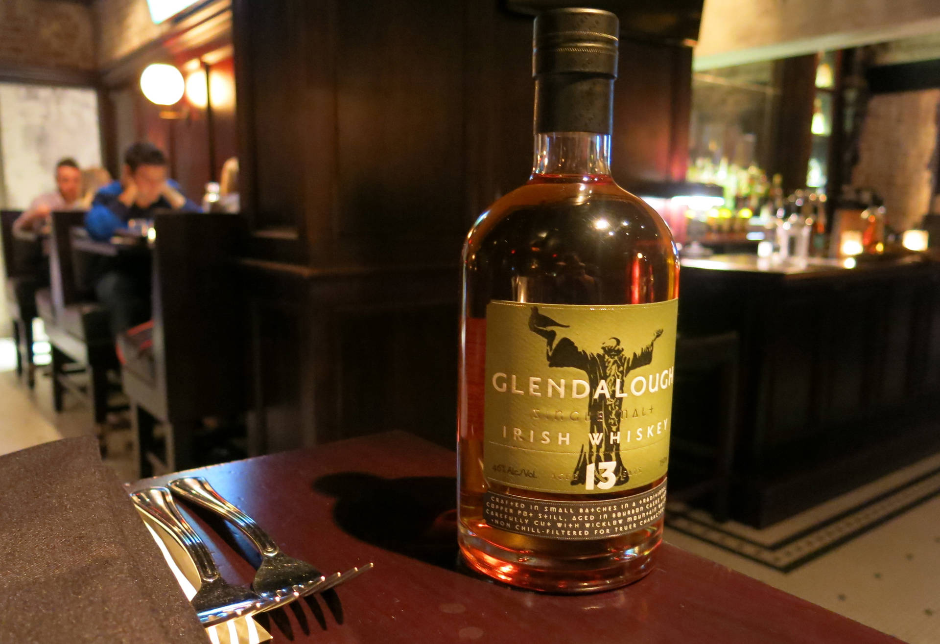 Caption: A Cosy Evening At Glendalough Irish Whiskey Bar And Restaurant Background