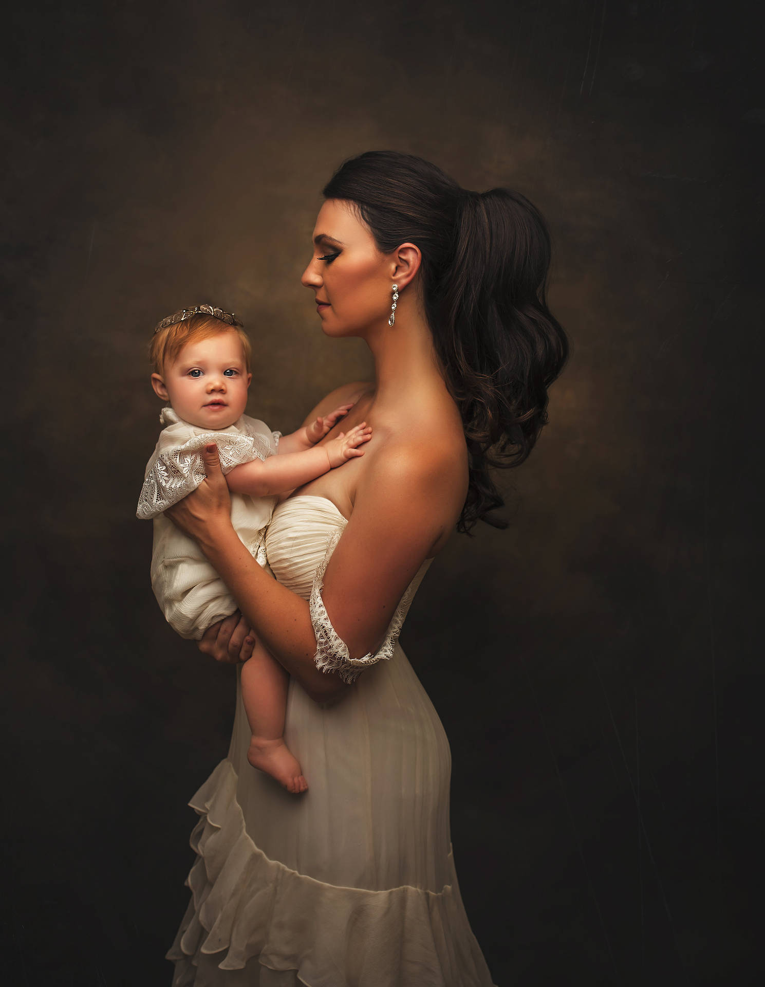 Caption: A Precious Moment Between Mother And Baby In A Luxurious Studio Shoot. Background