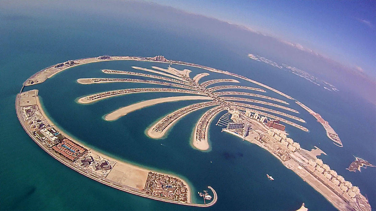 Caption: A Stunning Aerial View Of The Palm Island In Uae Background