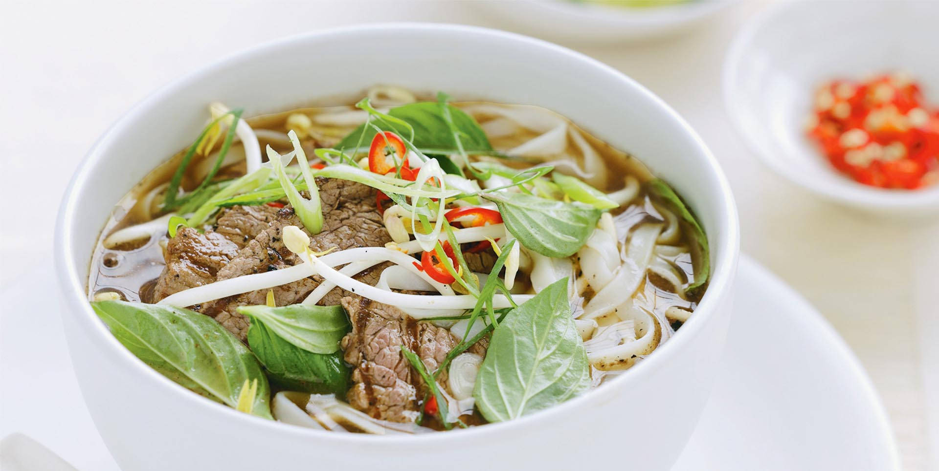 Caption: A Tempting Bowl Of Traditional Vietnamese Pho. Background