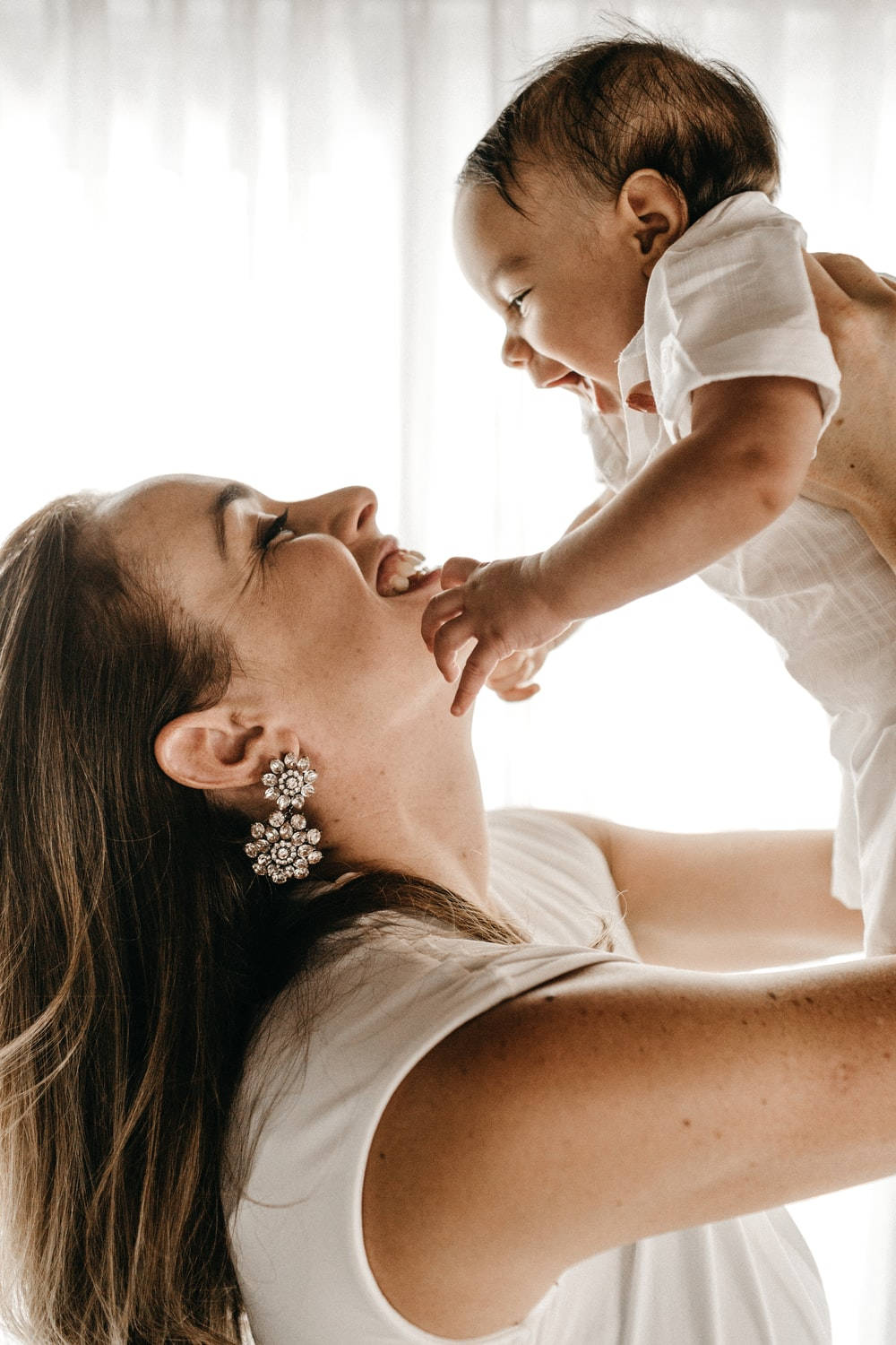 Caption: A Tender Moment Between Mother And Child Background