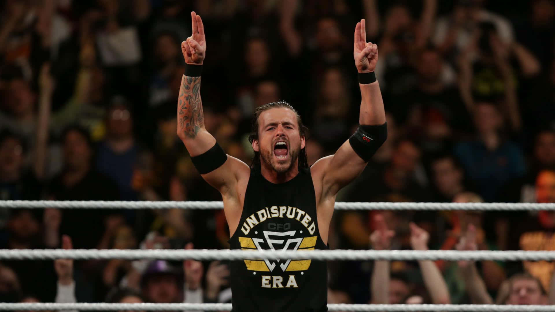 Caption: Adam Cole, Wrestling Maestro, Charging With Intensity Background