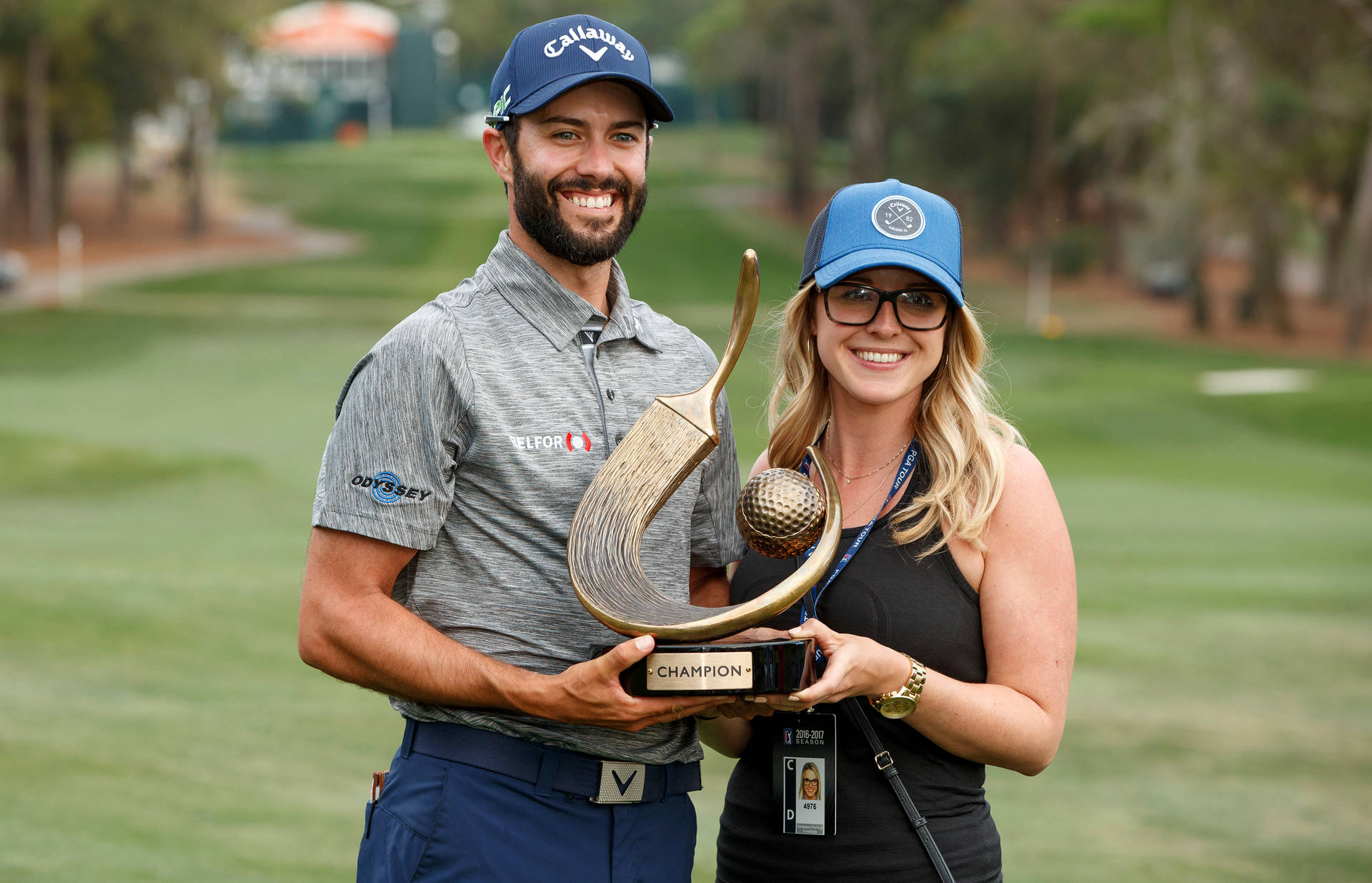 Caption: Adam Hadwin In Action On The Golf Course Background