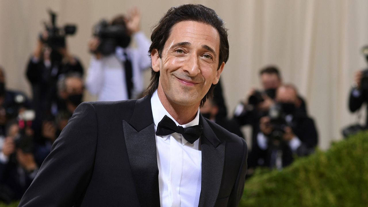 Caption: Adrien Brody Flashing A Charming Smile In Formal Wear