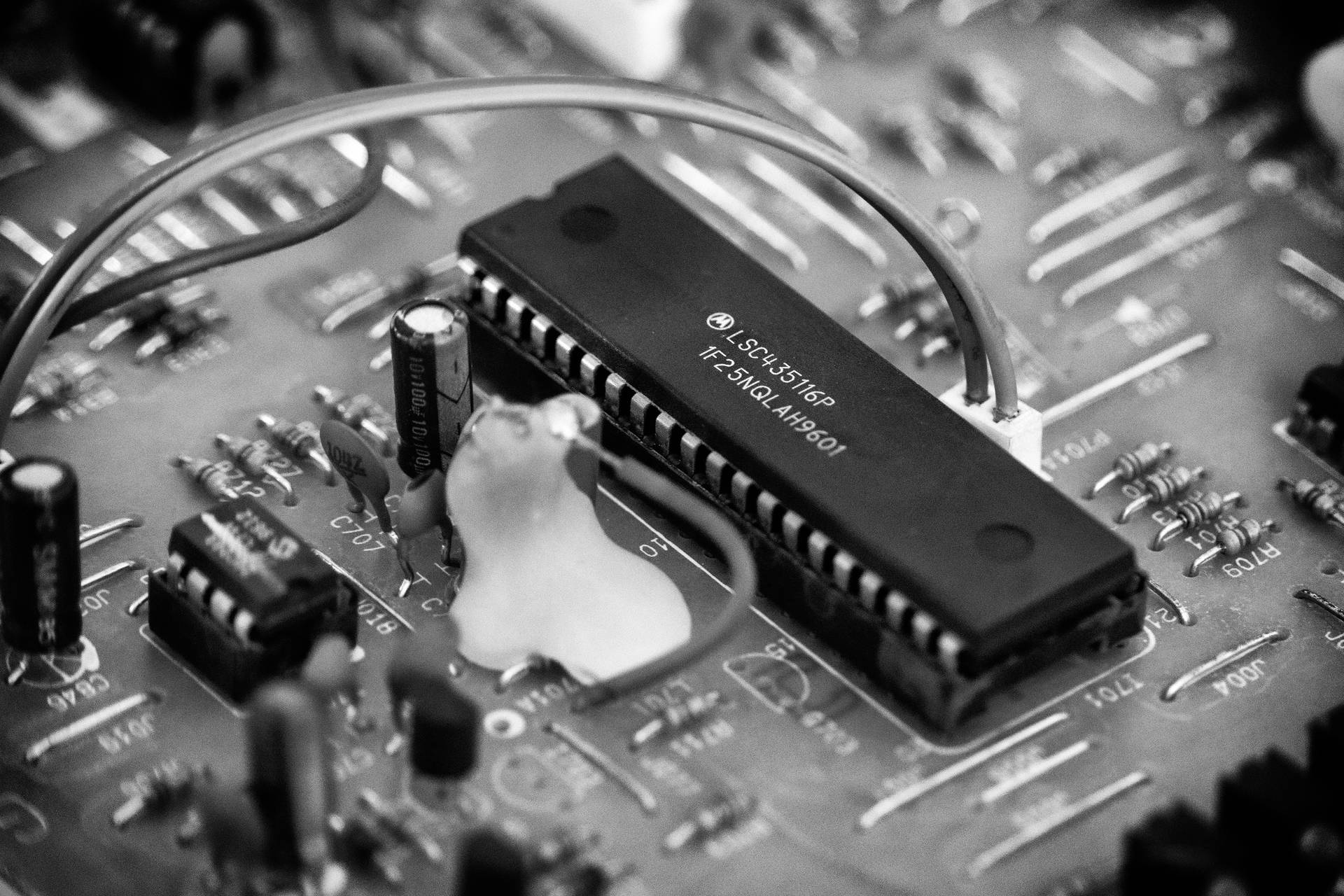 Caption: Advanced Modern Motherboard Close-up View Background