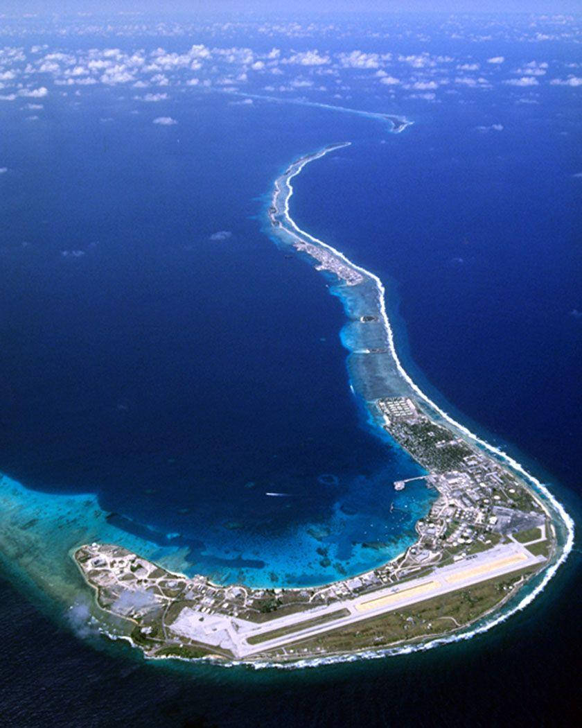 Caption: Aerial View Of Kwajalein Atoll, Marshall Islands Background