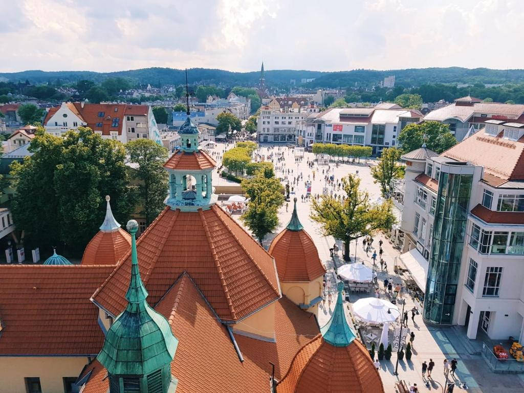 Caption: Aerial View Of Sopot Centrum Near The Crooked House, Poland Background