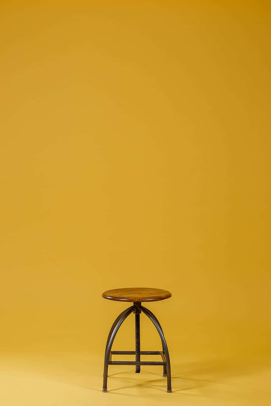 Caption: Aesthetic Wooden Stool Chair Background