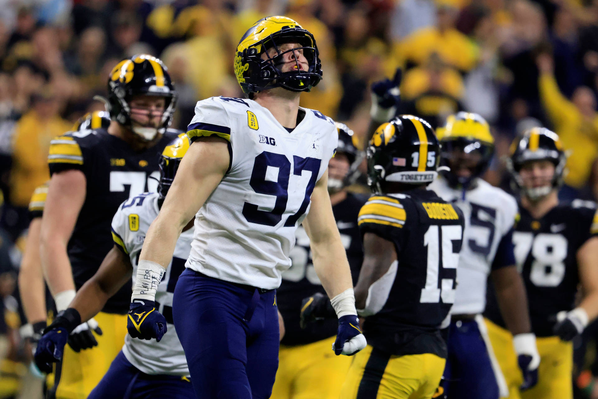 Caption: Aidan Hutchinson In His Victorious Moment At The Big Ten Conference Championship