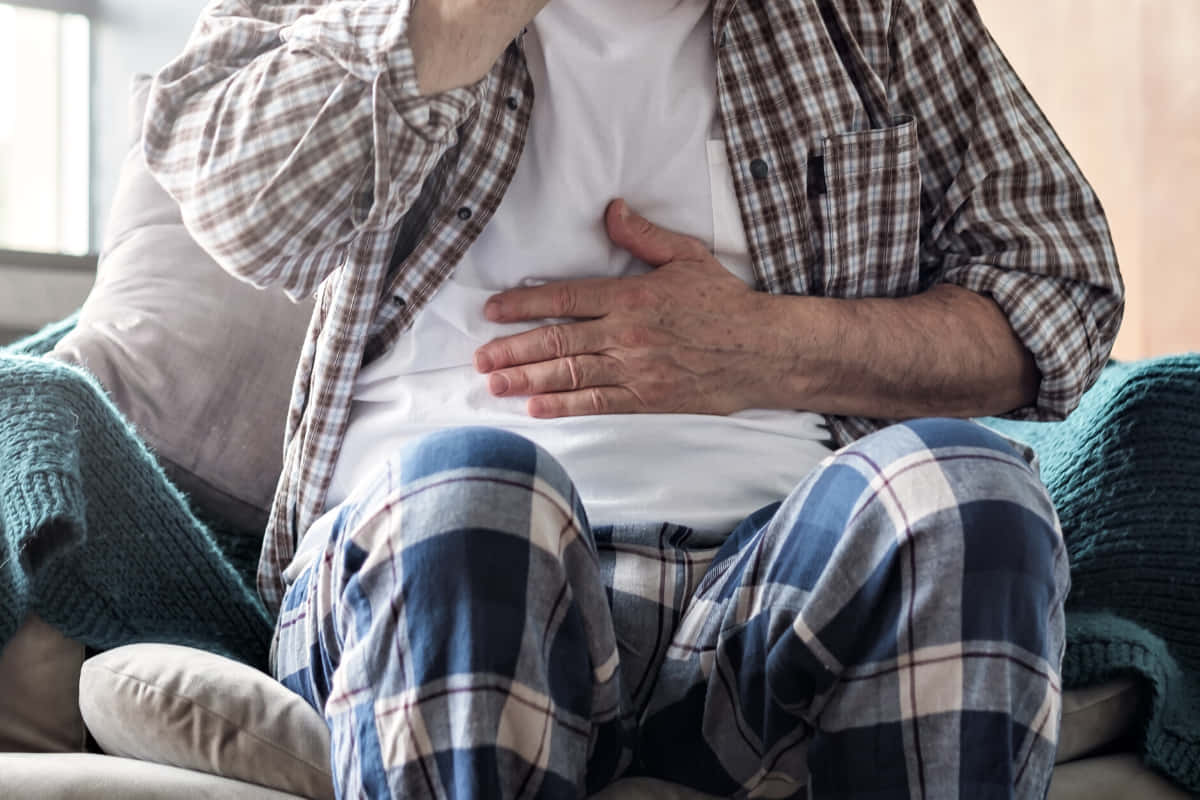 Caption: Ailing Elder Man Struggling With Nausea