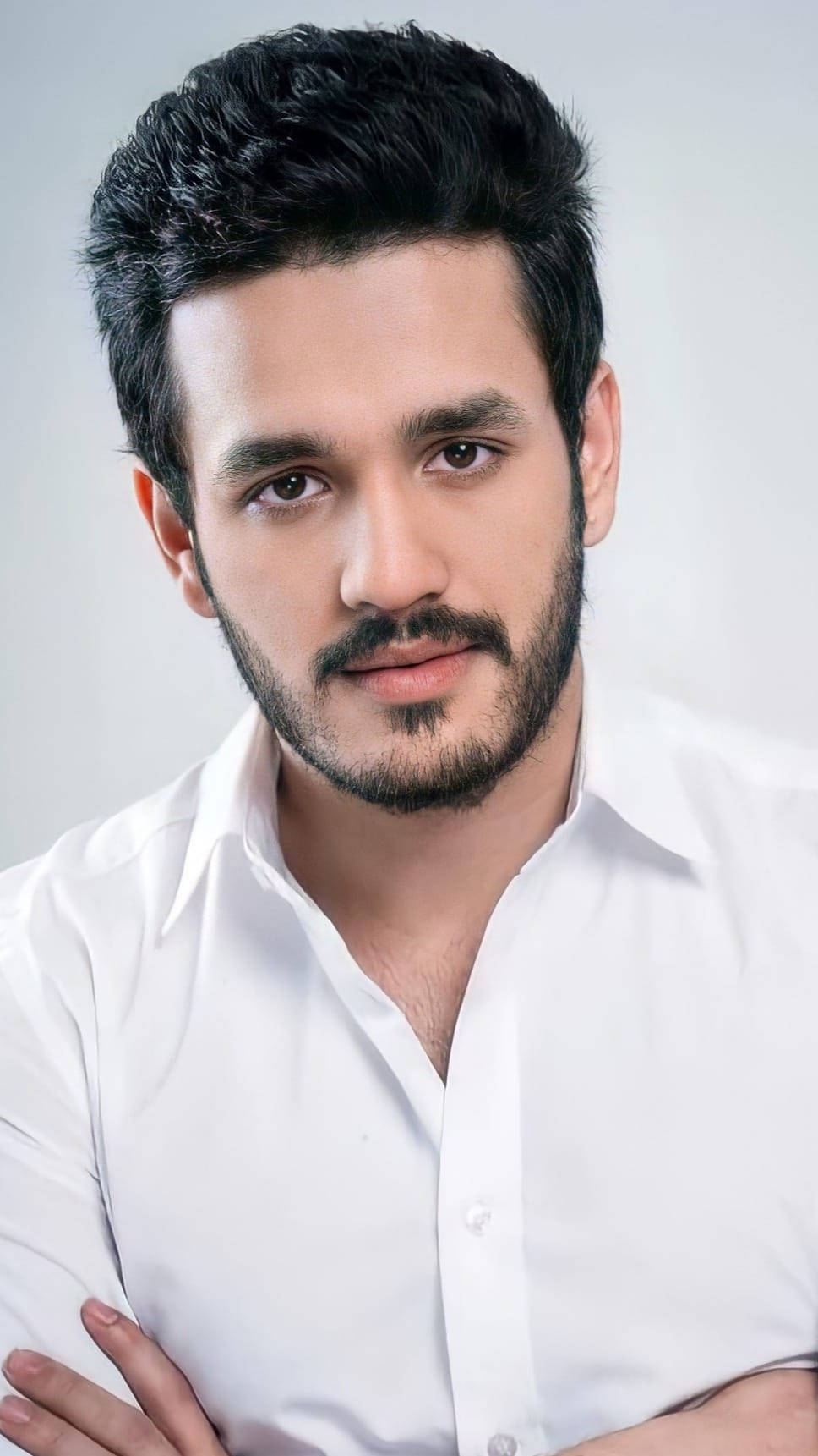 Caption: Akhil Akkineni Showcasing An Elegant Look In A White Shirt