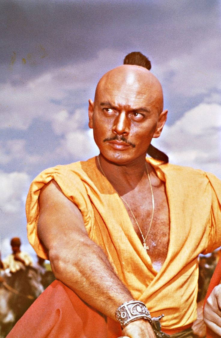 Caption: American Actor Yul Brynner In Taras Bulba Background