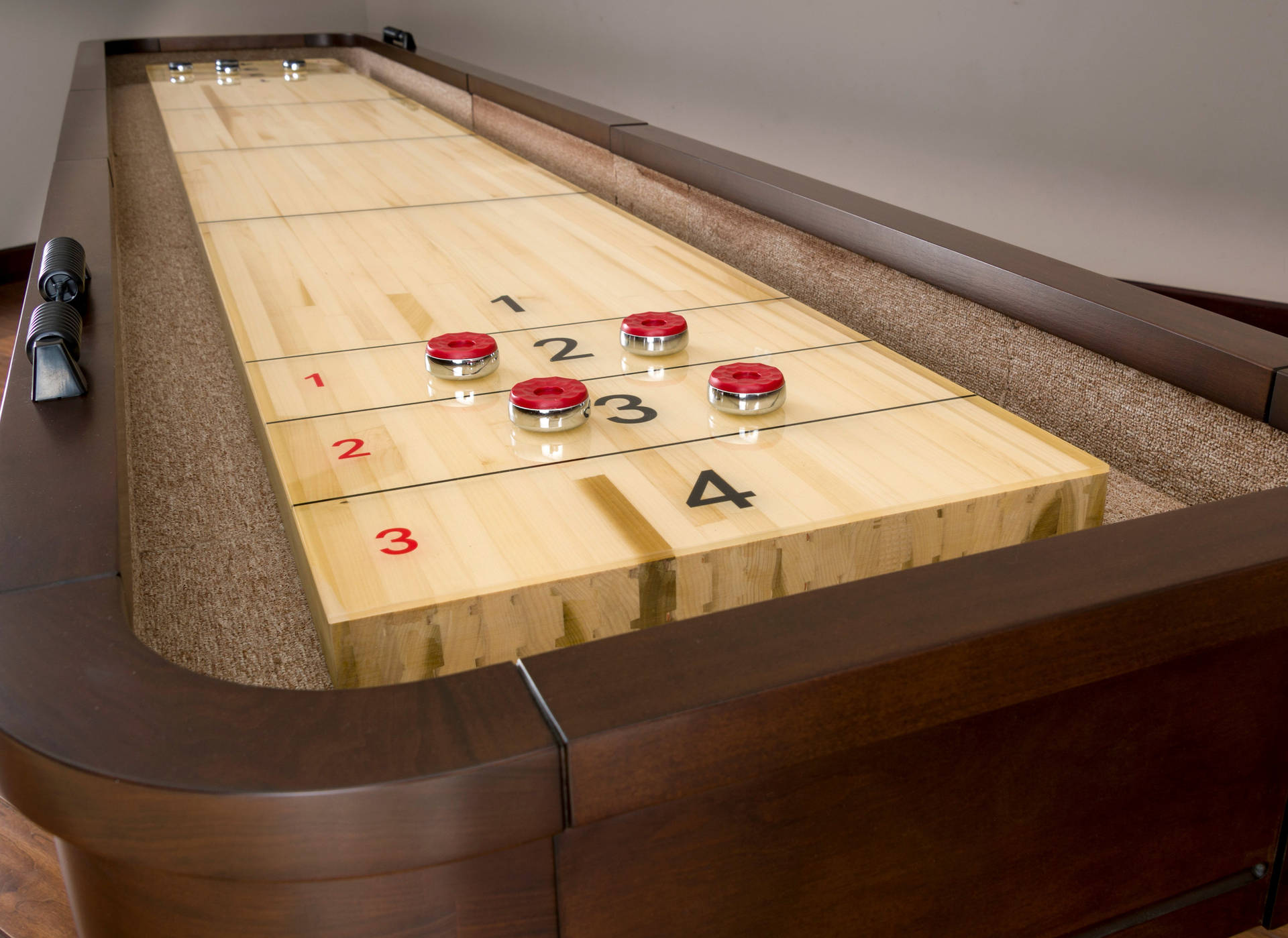 Caption: American Heritage Milan Shuffleboard Game In Action Background