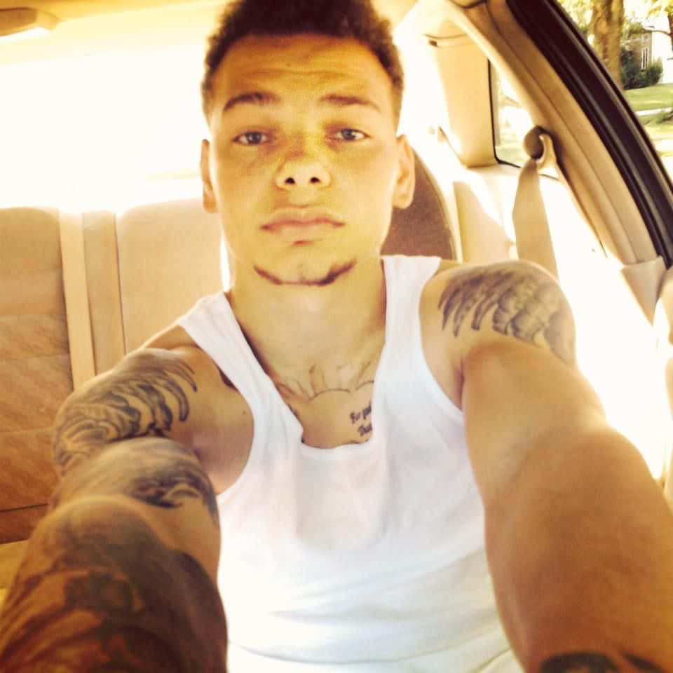 Caption: American Music Sensation, Kane Brown, In A Captivating Photo Shoot. Background