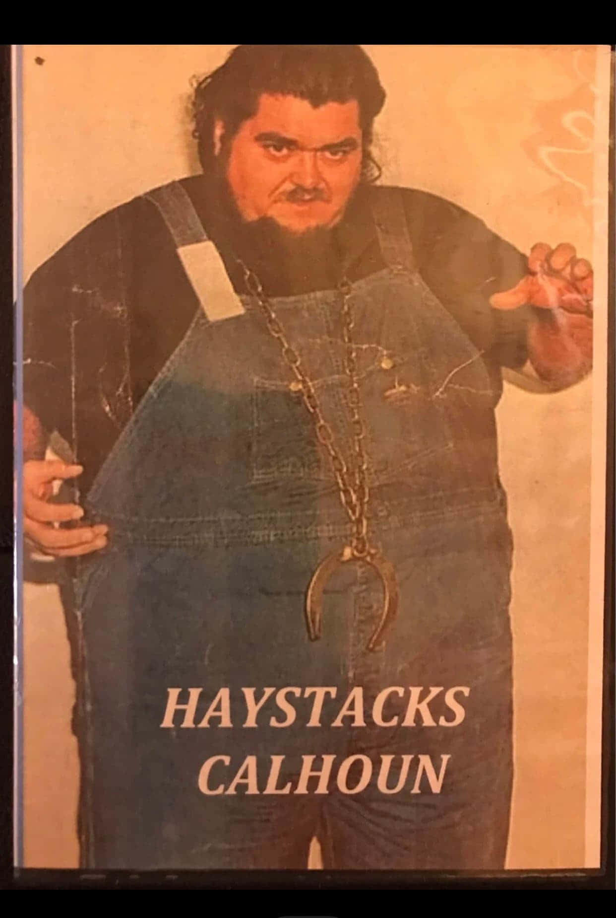 Caption: American Professional Wrestler Haystacks Calhoun In A Characteristic Sepia Portrait Background
