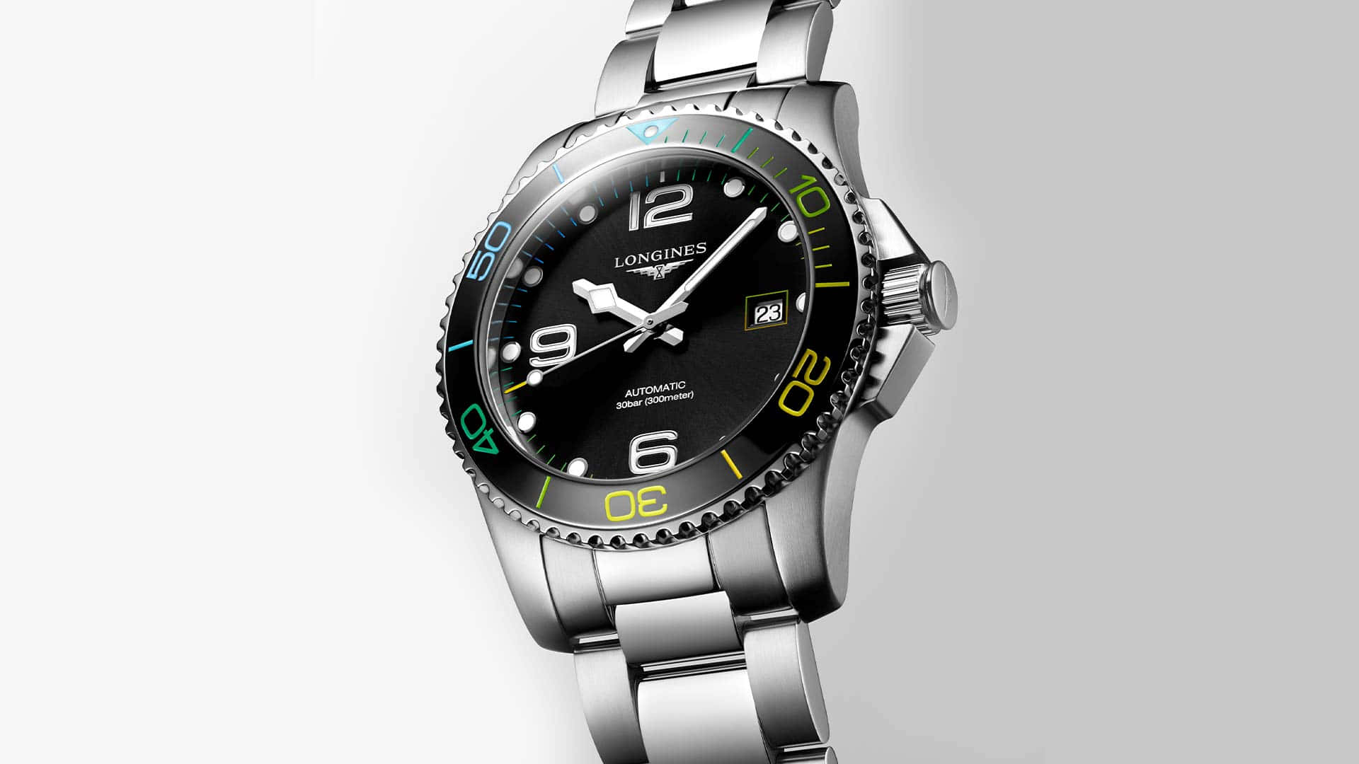 Caption: An Elegant Longines Silver Watch With Colored Bezel Background