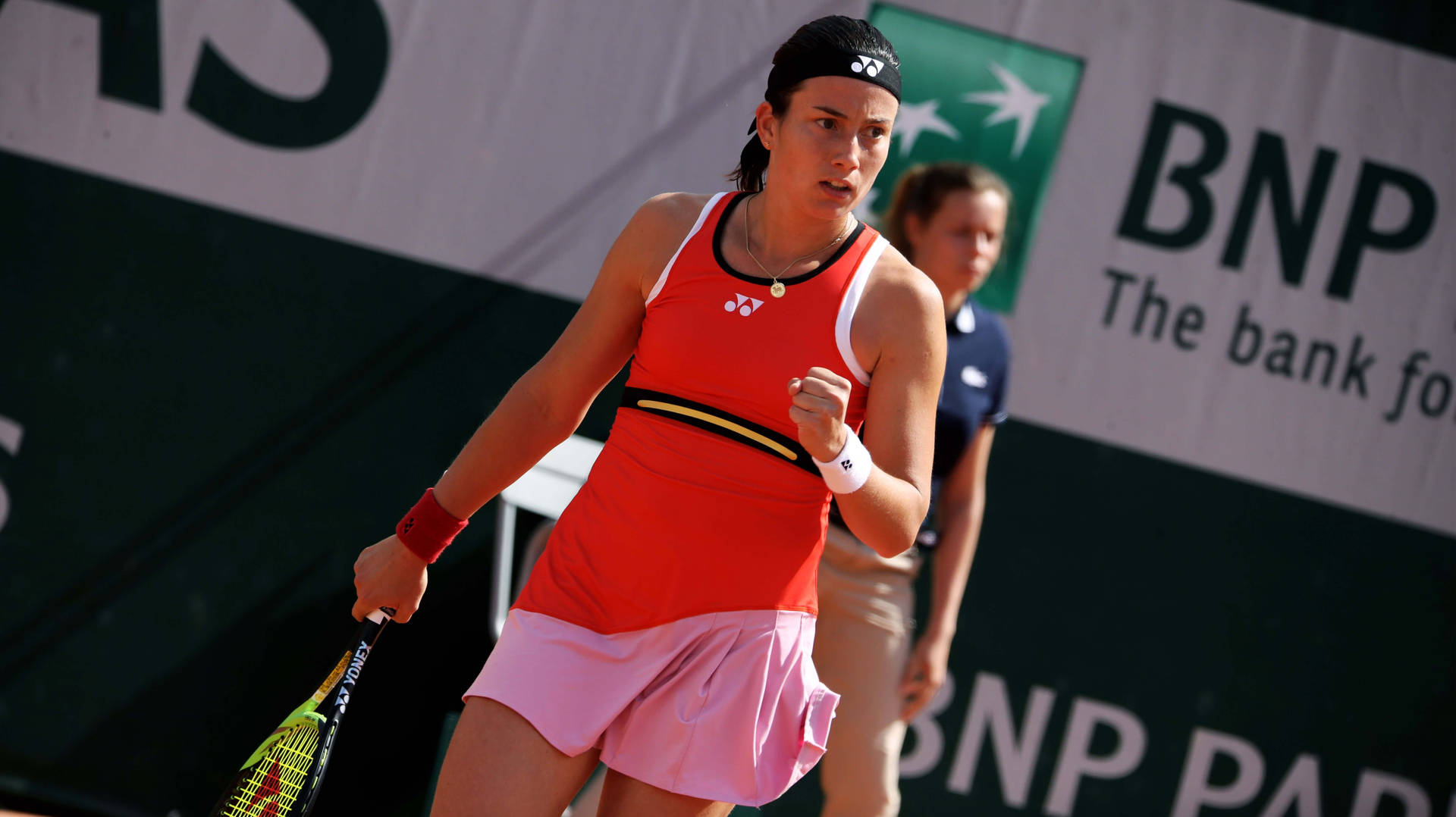 Caption: Anastasija Sevastova In Action With A Red Sleeveless Top