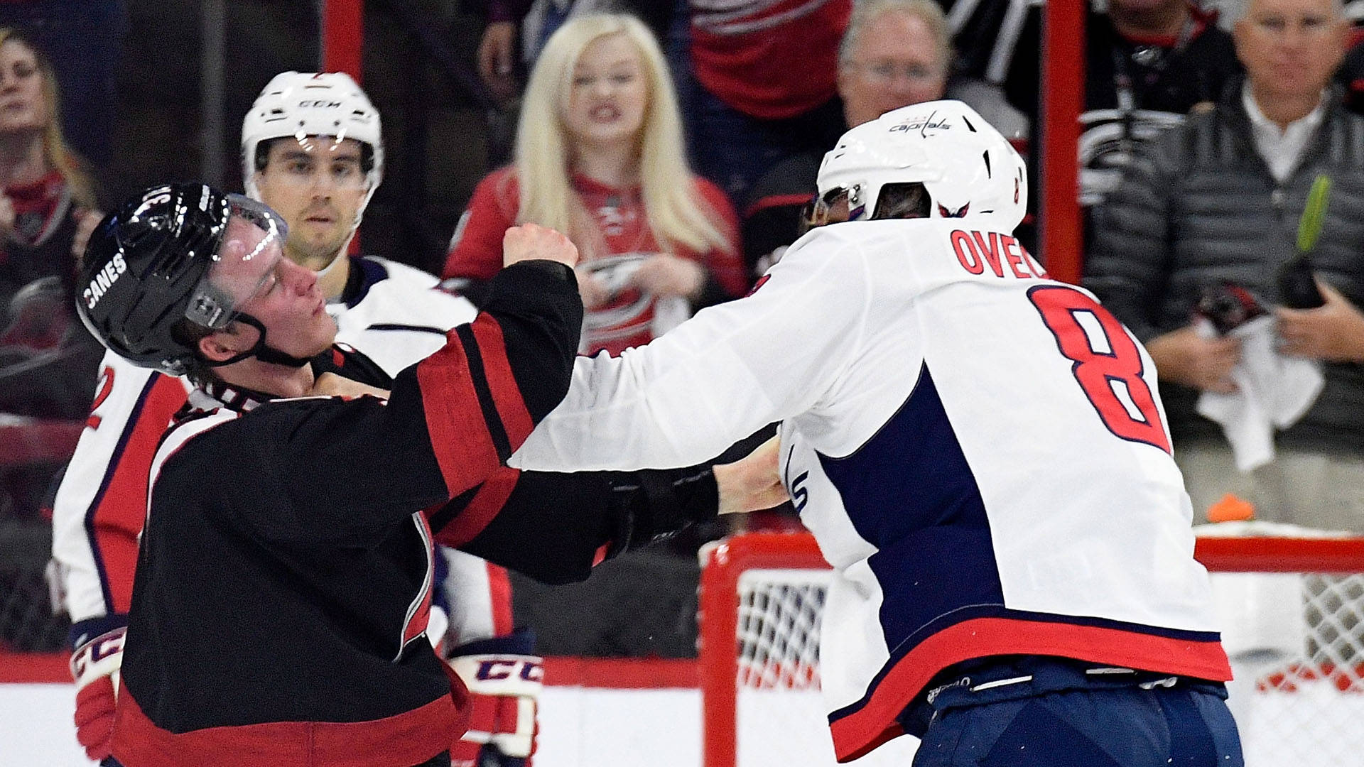 Caption: Andrei Svechnikov In Action Against Alexander Ovechkin Background