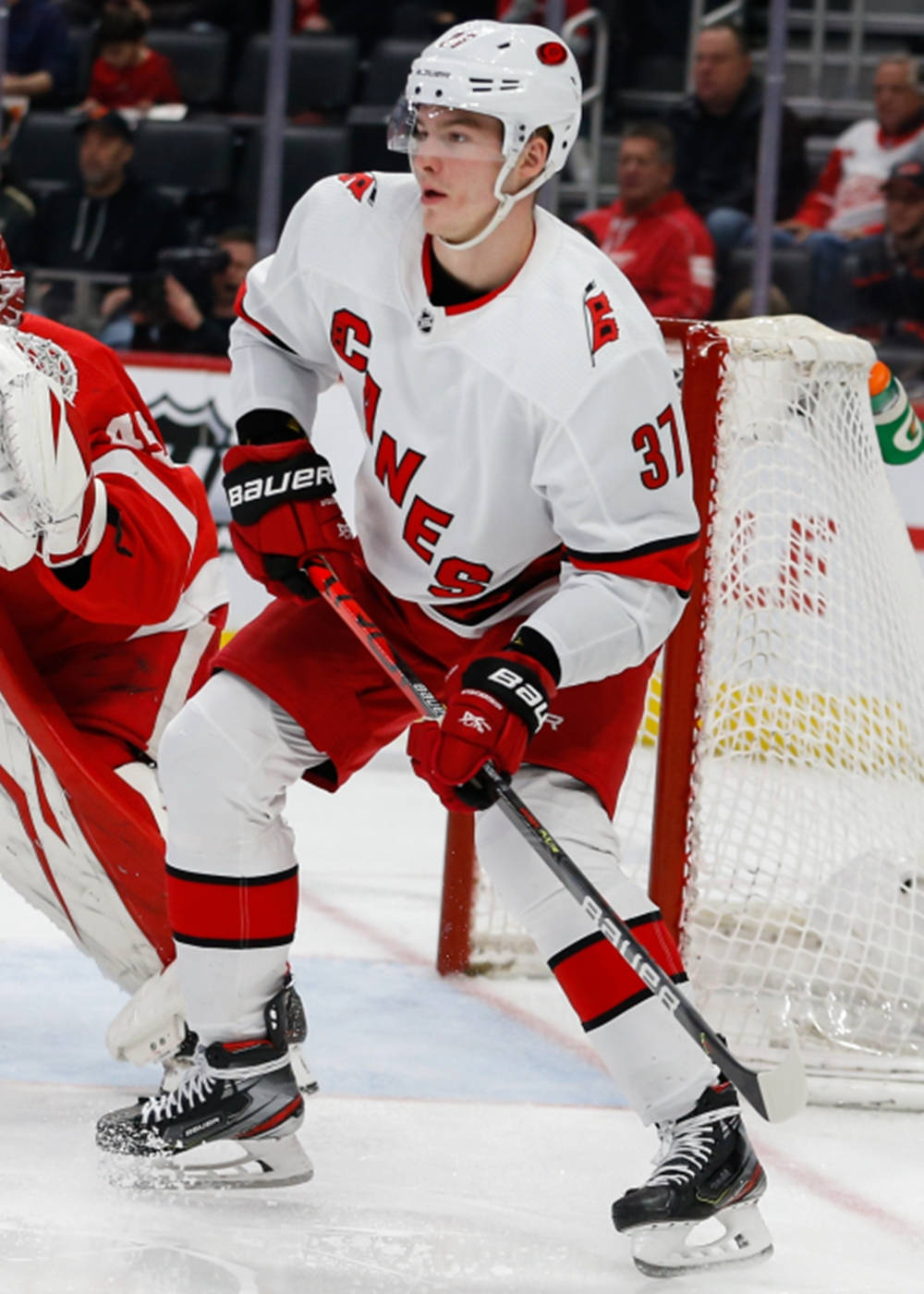 Caption: Andrei Svechnikov In White Hurricanes Jersey Background