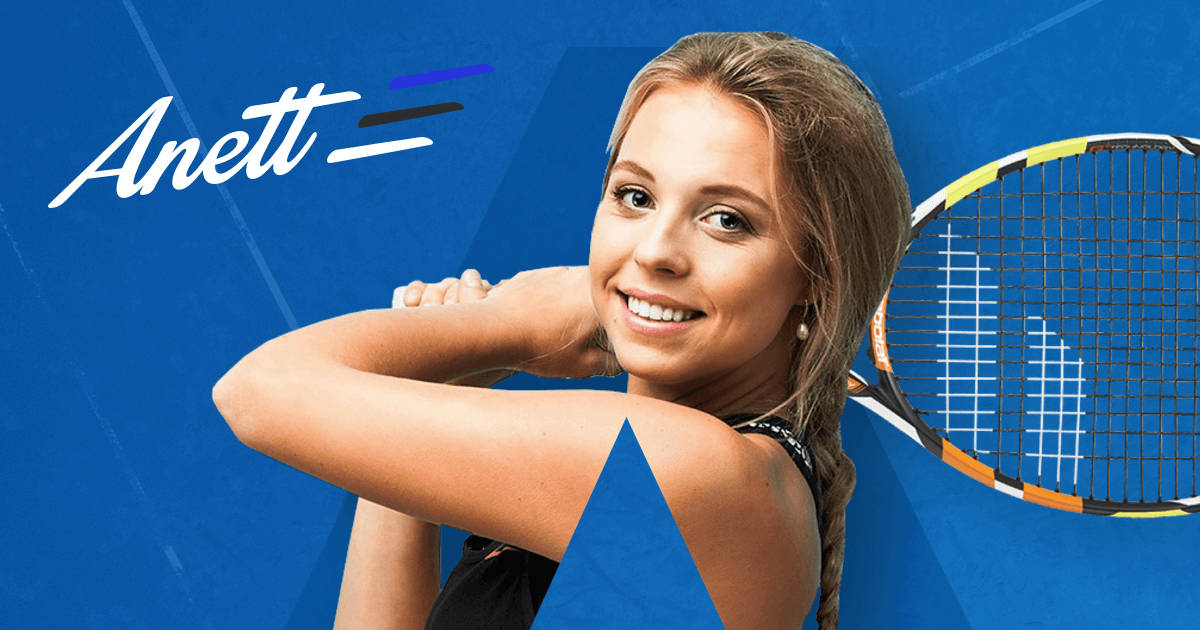 Caption: Anett Kontaveit Smiling Against A Blue Backdrop Background