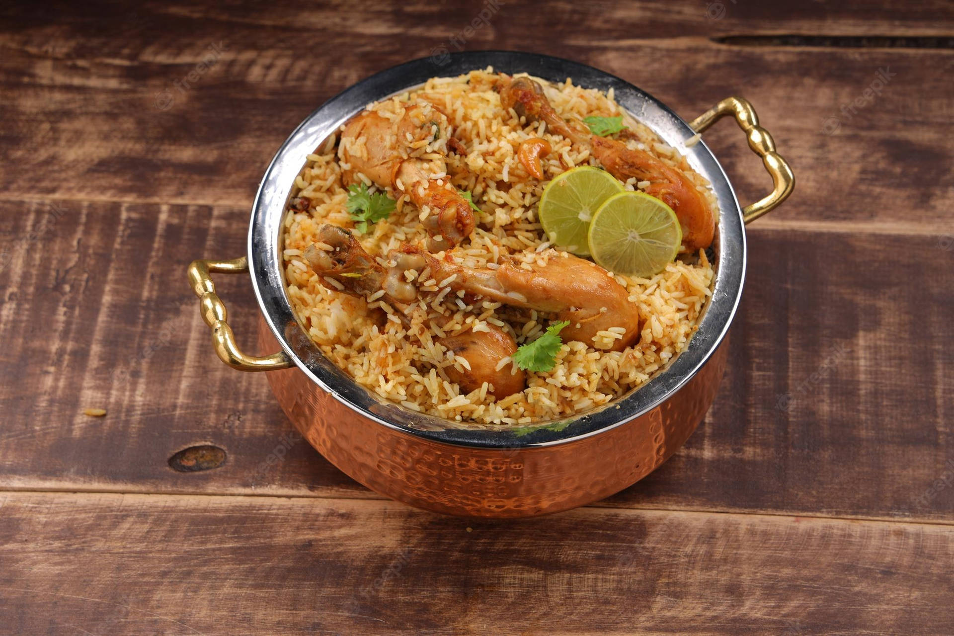 Caption: Aromatic Feast - Delightful Pot Of Biryani Background